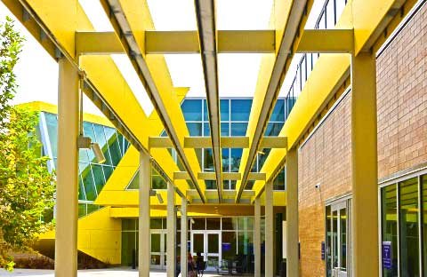 yellow sculptural entry outside of modern building